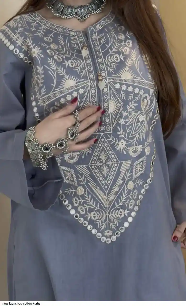 Elegant Grey Cotton Kurti with Heavy Embroidery – New Launch Collection Woman wearing grey embroidered cotton kurti with intricate front design, stylish ethnic outfit - Elegant Grey Cotton Kurti with Heavy Embroidery – New Launch Collection