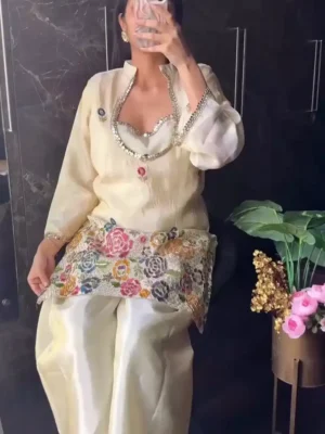 vory cream tissue shimmer silk ethnic co-ord set featuring a short kurta with an embroidered sweetheart bustier panel, real mirror work along the neckline, and a heavy multicolored floral sequin border, paired with loose matching palazzo pants