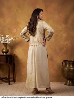 Off-white nylon tissue embroidered party wear co-ord set for women featuring a stitched crop top, matching wide-leg palazzo pants, and an intricate gold embroidered jacket.- off white stitched naylon tissue embroidered party wear