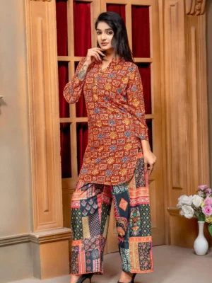 Rust orange Bandhani print viscose rayon co - ord set tunic paired with contrasting multi-print patchwork pants for women - Rust Orange Bandhani Tunic & Dhoti Pant Co-Ord Set
